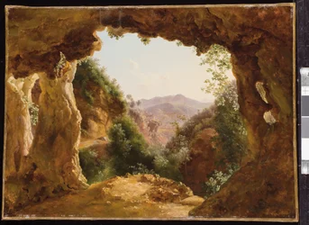 Eine Höhle in einer felsigen Landschaft