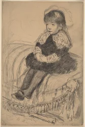 Auf einem Sofa sitzendes Kind
