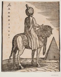 Turbantragender, unbewaffneter Reiter von schräg hinten gesehen; rechts im Hintergrund eine Pyramide