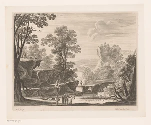 Fischer auf Felsen am Fluss