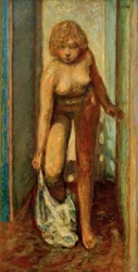 Sich entkleidende Frau