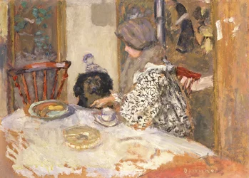 Frau mit Hund am Tisch