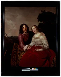 Ein Hochzeitsbildnis eines jungen Paares in einer Landschaft