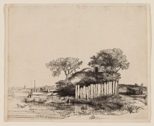 Ein Cottage mit weißem Zaun