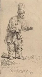 Ein Bauer mit hoher Mütze, der sich auf einen Stock lehnt