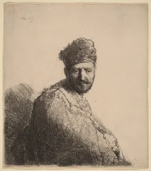 Bärtiger Mann in einer pelzbesetzten orientalischen Mütze und Robe: der Vater des Künstlers