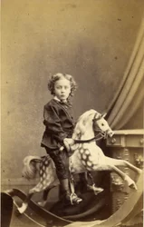 Junge auf einem Schaukelpferd sitzend, 1860er Jahre