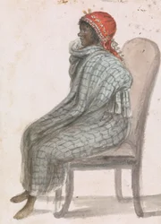 Afrikanische Frau, die auf einem Stuhl sitzt