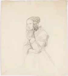 Frau, die ihr Kinn auf die linke Hand stützt