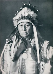 Ein Sioux-Häuptling in seiner Kriegsbemalung, 1912