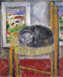 Katze auf einem Strohstuhl