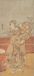 Der Schauspieler Sawamura Sojuro III hält ein Stück Brokat hoch
