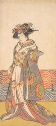 Der dritte Segawa Kikunojo als Frau, die in einem Raum mit Wellenmuster-Dado steht, ca. 1779