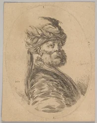 Ein türkischer Mann mit Bart und Turban mit einer langen Feder vorne