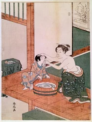 Eine nackte Mutter wäscht in Japan ihr Kind neben einem mit Wasser gefüllten Becken. Holzschnitt von Suzuki Harunobu (1725-1770). 1766-1768. Maße: 0,27 x 0,201 m. Paris, Musée Guimet, Nationalmuseum für asiatische Kunst