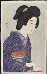 Frau sitzt an einem Kohlenbecken, Februar 1925