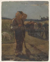 Bauer, der mit einer Schaufel auf dem Feld steht
