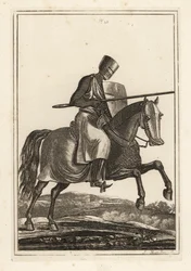 Angreifender Ritter des 12. und 13. Jahrhunderts in Kettenhemd, flachem Helm, Lanze, Heaterschild, Schienbeinrüstung, Kriegssattel