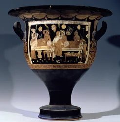 Rotfiguriger Glockenkrater, der eine Bankettszene darstellt