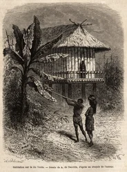 Ein Paar Indianer aus Rio Verde (Brasilien), der Mann mit seiner Blasrohr, vor einem typischen Pfahlbau. Gravur zur Illustration der Reise nach Neugranada, von Dr. Saffray, 1869, veröffentlicht in „Le tour du monde“ 1873, herausgegeben von Edouard Charton,
