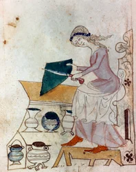 Eine junge Frau schärft ein Messer. Miniatur aus einer provenzalischen Handschrift des Typs „Sprüche der Philosophen“ (MS Palat. 586), 14. Jahrhundert. Biblioteca Nazionale, Florenz