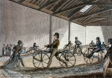 Innere Ansicht des Reitplatzes für Steckenpferde. Mann fährt Fahrräder (pedalfreie Fahrräder, erfunden von Baron Karl Drais).
