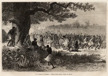Die Vouagogo (Stamm aus Tansania) in Vorbereitung auf den Krieg, unter dem Baum, der Autor der Geschichte Henry Morton Stanley (1841-1904). Gravur zur Illustration der Reise auf der Suche nach Livingstone, in Zentralafrika, von Henry Stanley, Korrespondent