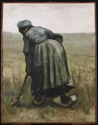 Eine Frau mit Spaten, von hinten gesehen