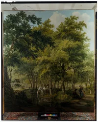 Bauern mit einem Wagen in der Nähe des Ufers eines Flusses in einer Waldszene