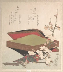 Pflaumenblüten und Kuchenschachtel