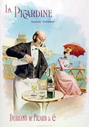 Ein Kellner bereitet ein Glas Absinth vor